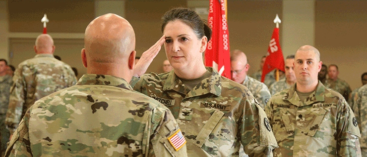 Col. Jennifer Mitchell (saluting) assumes command of the 16th Engineer Brigade from Maj. Gen. John C. Harris Jr., Ohio assistant adjutant general for Army.