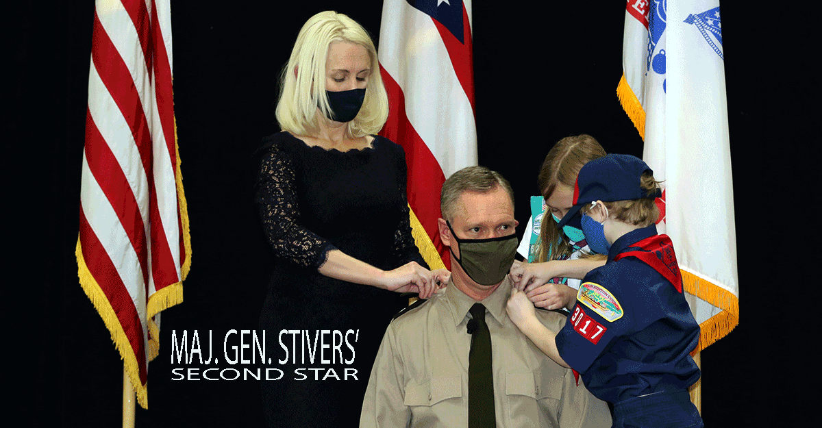Wife, son and daughter pin second star on Maj. Steve Stivers shoulder epaulettes.