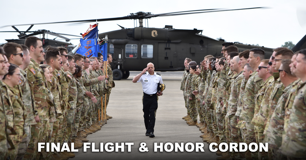 MG John C Harris salutes formation of Soldiers as he walks through from Black Hawk helicopter.