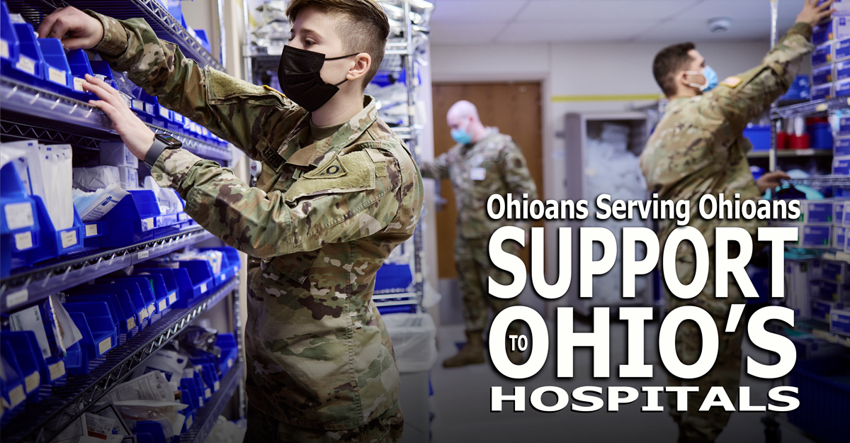 Three uniformed Guardmembers file prescriptions in bins.