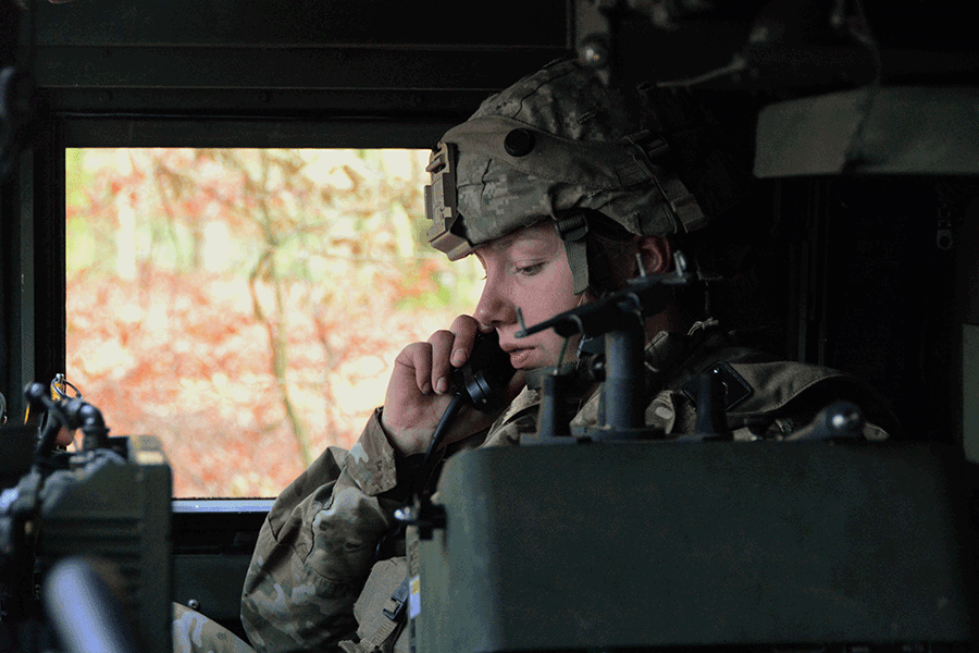 Female Soldier talks in head gear