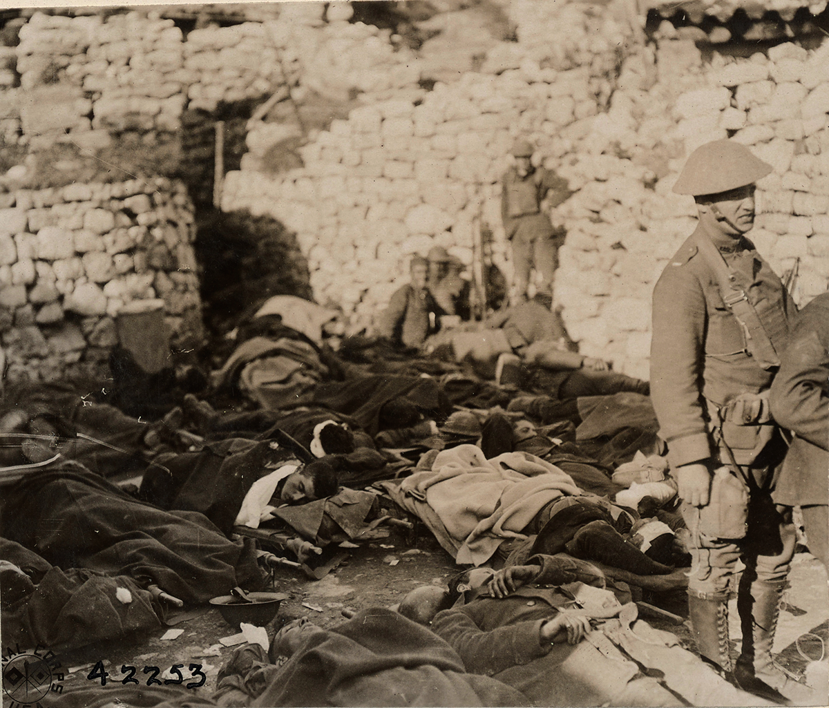 Sepia tone of Soldiers sleeping under blankets on ground