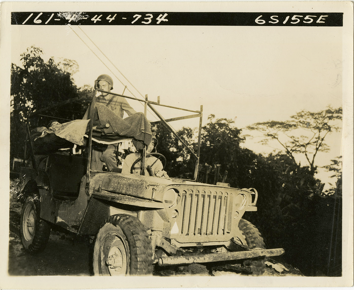 Sepia tone of Soldier in jeep