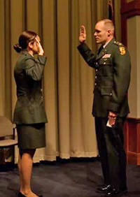 Cadet Elena Gonzalez (left) receives her commission through the University of Toledo Army ROTC program.