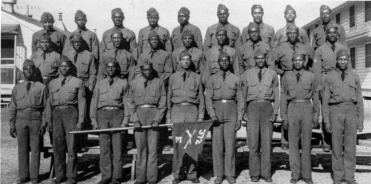 Group of black soldiers pose for unit pic.
