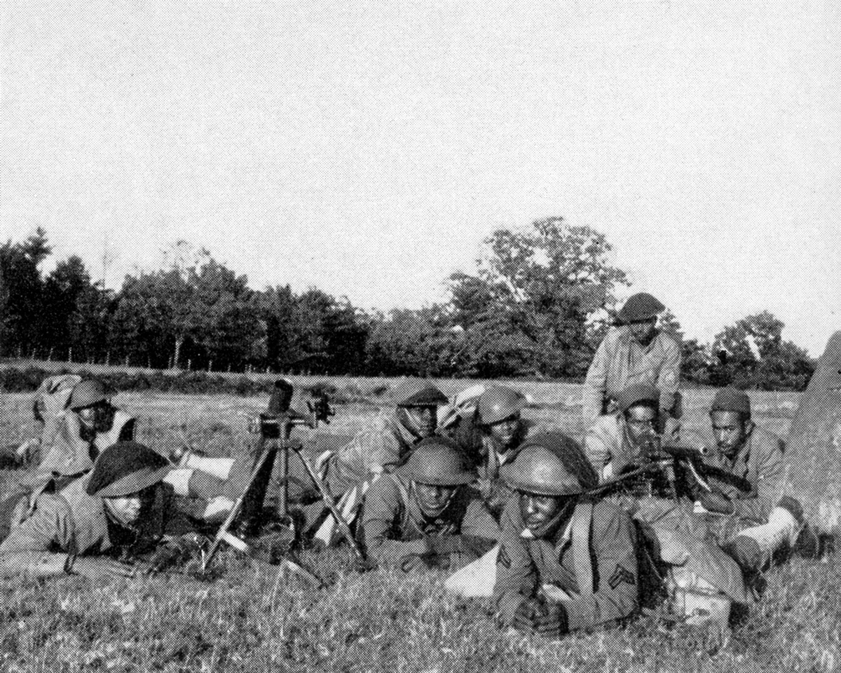 Black soldiers on observing from the ground in field.