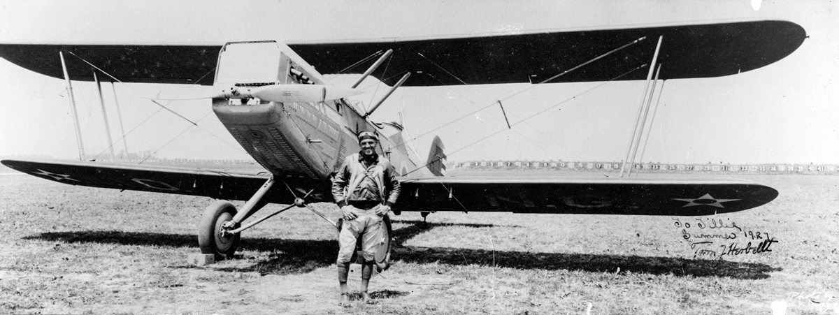 Herbert in front of aircraft.