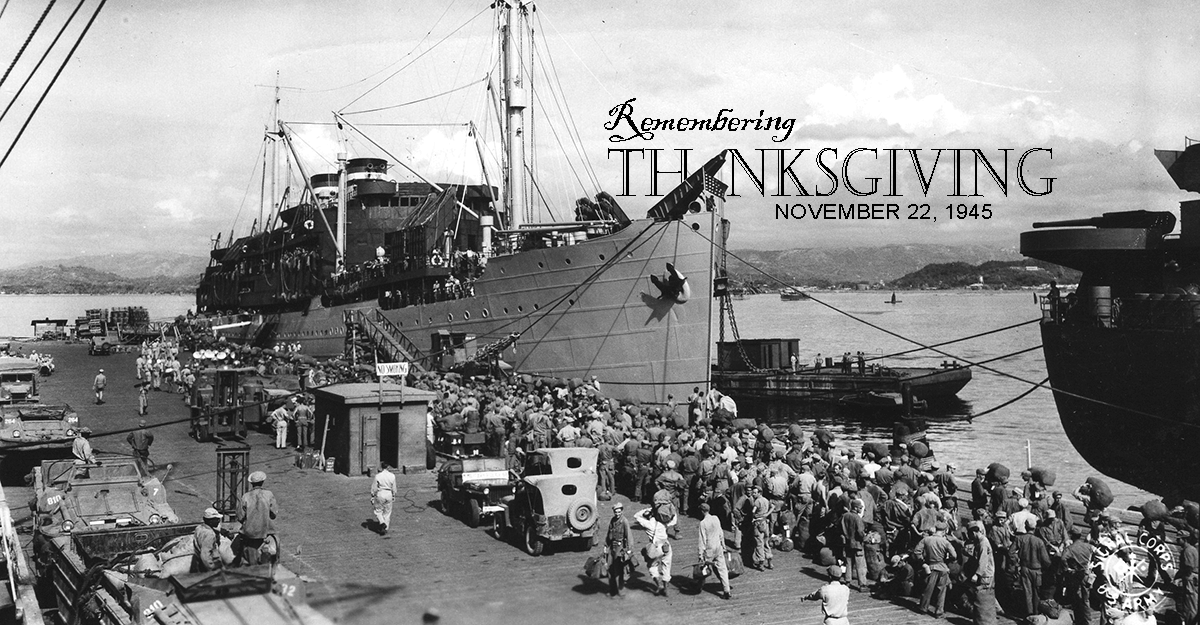 KBlack and white image of Soldiers lining the dock preparing to board ship.