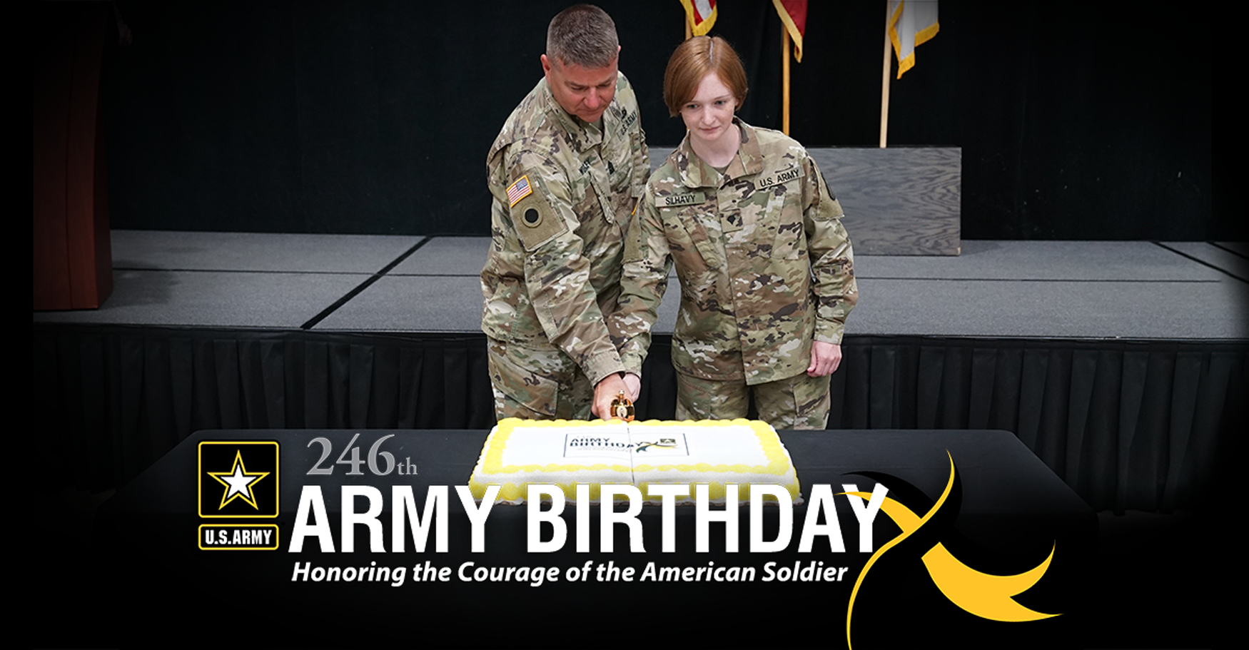 Male and female Soldiers cut cake with sword.
