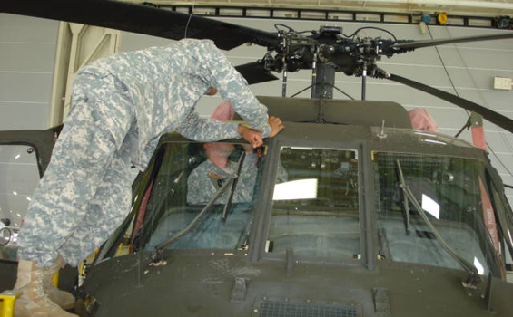 Soldiers from the Ohio Army National Guard's Company D, 1st Battalion, 137th Aviation Regiment perform maintenance on a UH-60 Black Hawk helicopter