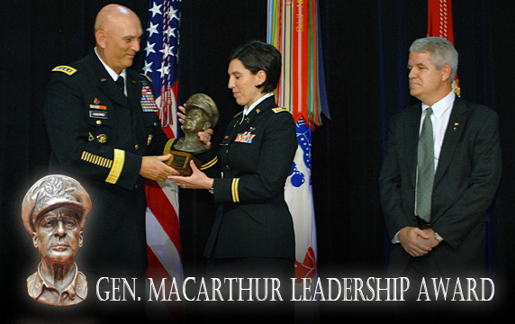 Ohio Army National Guard Capt. Audrey L. Fielding (center) accepts her 2011 General Douglas MacArthur Leadership Award