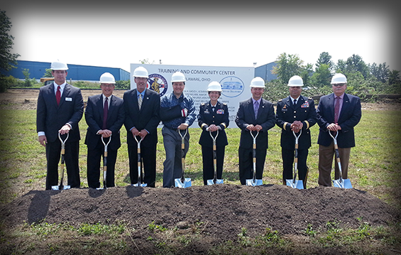 Federal, state and local officials including U.S. Rep. Pat Tiberi (fourth from left); Maj. Gen. Deborah A. Ashenhurst (fifth from left), Ohio adjutant general; and state Rep. Andrew Brenner (third from right) conduct a groundbreaking ceremony Aug. 23, 2013, for the Ohio National Guard's Delaware Training and Community Center.