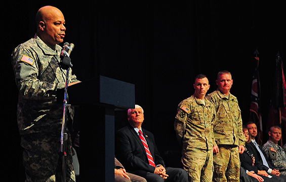 Brig. Gen. John C. Harris Jr. (far left), Ohio assistant adjutant general for Army, recognizes the commitment and leadership of Capt. Chad A. Apple and 1st Sgt. Joseph D. Bernert (standing, from left), commander and first sergeant of the 837th Engineer Company, at the unit's welcome home ceremony 