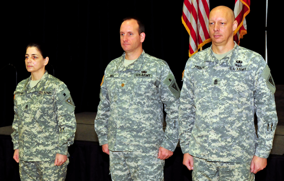 First Sgt. Dorie Anguay (from left), incoming first sergeant of the Ohio Army National Guard's Joint Force Headquarters and a Wapakoneta, Ohio, resident, Maj. Robert Noll, commander of Joint Force Headquarters, and 1st Sgt. Joseph Fridley, outgoing first sergeant, prepare to conduct a change of responsibility ceremony Jan. 26, 2013, at the Maj. Gen. Robert S. Beightler Armory in Columbus, Ohio. 