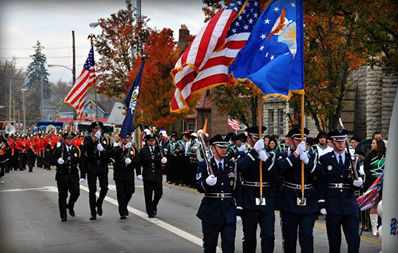 Members of the 179th Airlift Wing Color Guard (foreground, right) participate in the Veterans Day parade Nov. 11, 2013, in downtown Mansfield, Ohio. 