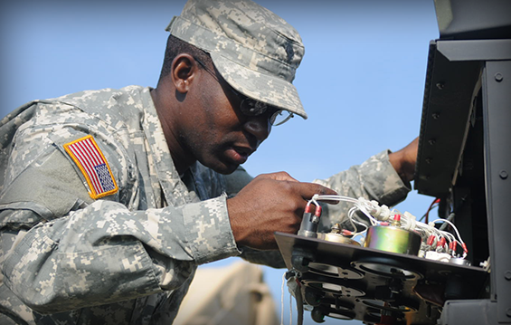 Spc. Livingston Newman, a power generator equipment repairer with Support Company, 112th Engineering Battalion, performs preventative maintenance checks and services (PMCS) on a generator during annual training 2013 at Camp Ravenna Joint Military Training Center.