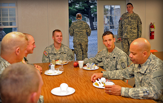 Brig. Gen. John C. Harris Jr. (right), Ohio assistant adjutant general for Army, and Command Sgt. Maj. Rodger M. Jones (second from left), Ohio Army National Guard state command sergeant major, talk during breakfast with Soldiers from the 285th Medical Company during their annual training