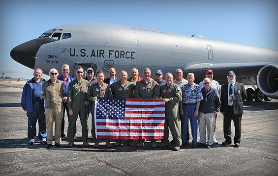 The crew of the 145th Air Refueling Squadron's";Fini-Flight" along with past unit members, stand in front of a KC-135 Stratotanker refueling aircraft at Rickenbacker Air National Guard Base in Columbus, Ohio