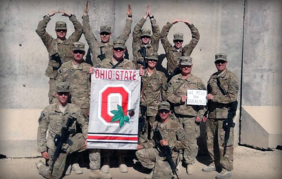 Soldiers from the 1487th Transportation Company in Piqua, Ohio show their Buckeye pride by forming the popular