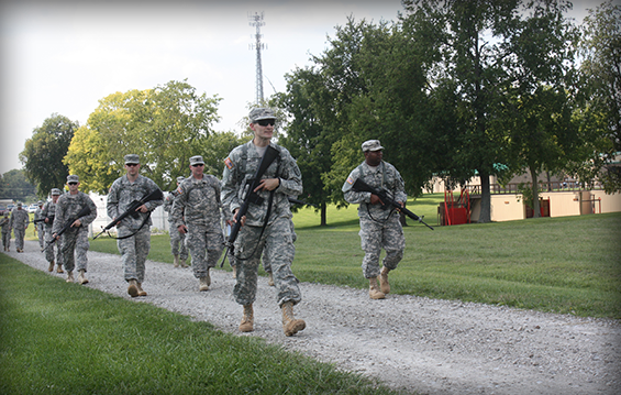 Soldiers in the Reserve Component Warrant Officer Candidate School practice a tactical road march.