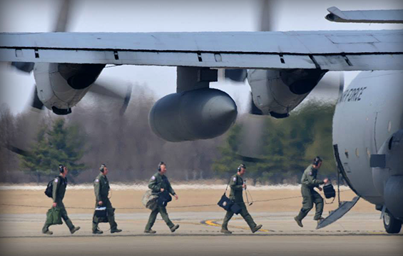 Flight crew members from the 164th Airlift Squadron board a C-130H Hercules.