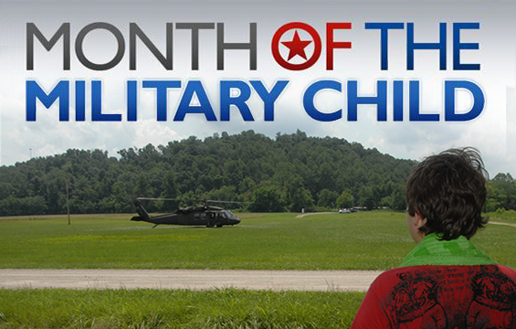 Month of the Military Child - child watches helicopter land at Camp Corral 