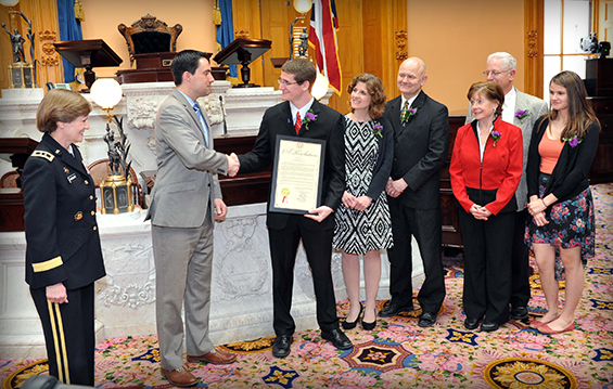 Josh Yoho (third from left) receives the Ohio Operation: Military Kids Youth of the Year award from former Ohio Army National Guard member and state Sen. Frank LaRose, of Ohio's 27th District .