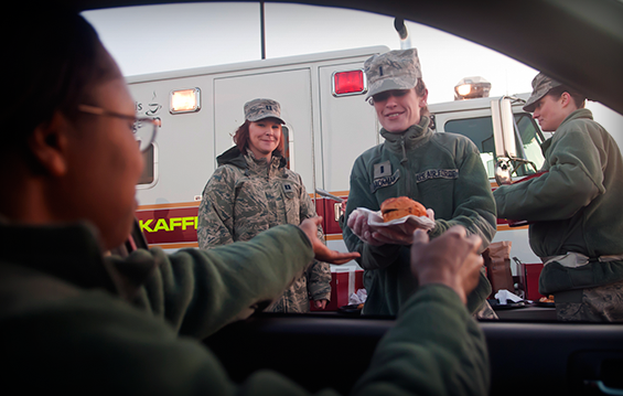 Tech. Sgt. Natonja Rutledge stops by the 121st Air Refueling Wing Company Grade Officers Committee Breakfast Drive-Thru fundraiser 