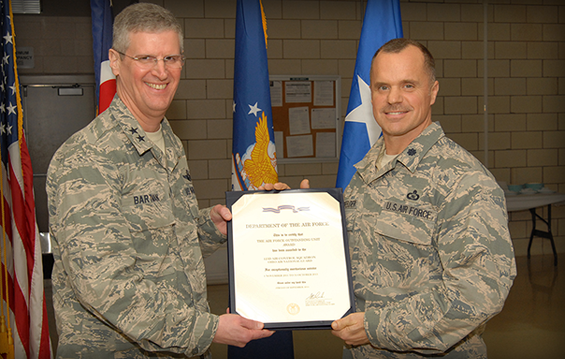 Lt. Col. Steven Breitfelder (right), commander 123rd Air Control Squadron, receives the Air Force Outstanding Unit Award from Maj. Gen. Mark E. Bartman.