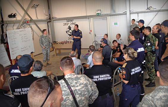 Firefighters from the Ohio Army National Guard’s 5694th Engineer Detachment participate in a training class with firefighters from various European countries' militaries.