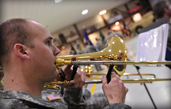 Sgt. John D. Connors of the 122nd Army Band plays the trombone 
