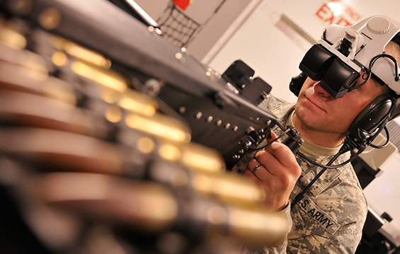 Sgt. Ken Arner, a truck driver with the 1485th Transportation Company, located in Dover, Ohio, readies to man the gunner position in the Virtual Convoy Operations Trainer.