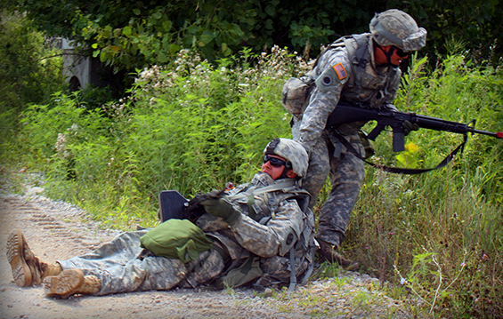 A Soldier with the Ohio Army National Guard’s 811th Engineer Company (Sapper) works to move one of his comrades with a simulated injury to safety.