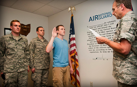 Wil Ruoff is administered the oath of enlistment by Lt. Col. Todd Folk, commander of the 121st Comptroller Flight, at Rickenbacker Air National Guard Base.