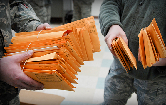 Airmen from the 180th Fighter Wing compile more than 30 registration packages to send to the Salute to Life Program.