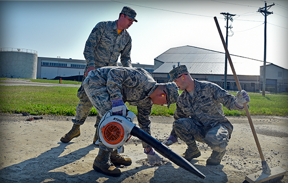 Staff Sgt. Henry Zaborniak (from left) offers instruction to Senior Airman Min Ji and Senior Airman Christopher Coburn during a spall repair real-world exercise.