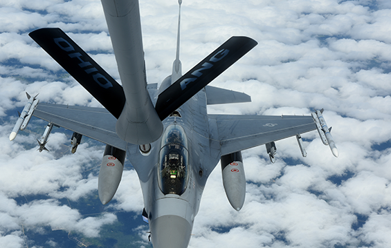 Col. Craig Baker, commander of the 180th Fighter Wing, and Col. Jim Jones, commander of the 121st Air Refueling Wing, fly in an F-16 Fighting Falcon during a refueling mission with the 121st ARW.