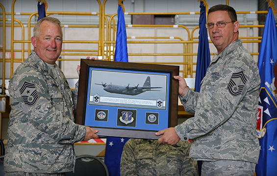 Chief Master Sgt. Thomas A. Jones (right) assumes the position of 179th Airlift Wing command chief, taking over for retiring Chief Master Sgt. Thomas A. Gremling.