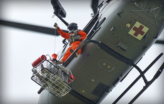 Soldiers from Detachment 1, Company D, 1st Battalion, 376th Aviation Regiment, based in North Canton, Ohio, practice live rescue hoist operations from a LUH-72 Lakota medical helicopter. 