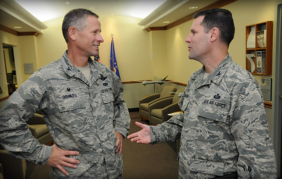 Schnulo talks with Col. John Devillier, 88th Air Base Wing commander, at the Springfield Air National Guard Base in Springfield, Ohio.
