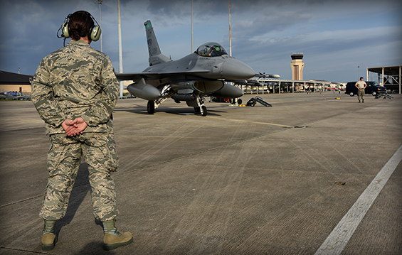 Master Sgt. Stacie Dice, an F-16 mechanic with the 180th Fighter Wing, prepares to launch an F-16 Fighting Falcon.