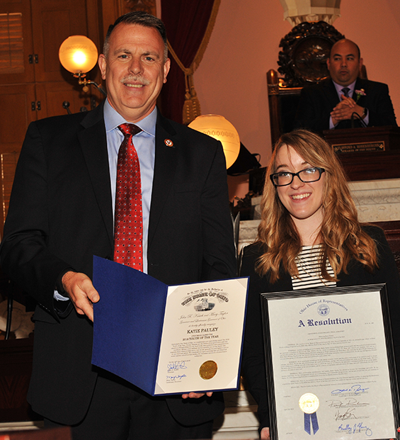 Katie Pauley (right), receives a proclamation on behalf of Gov. John Kasich from retired Col. Chip Tansill, Ohio Department of Veteran Services director, recognizing her as the Ohio Military State Youth of the Year.