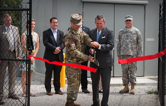 Brig. Gen. Anthony P. Digiacomo II (left), commander of the Ohio Army National Guard Special Troops Command (Provisional), and state Sen. John Eklund, Ohio District 18, cut the ribbon on a new water and sewer lift station.