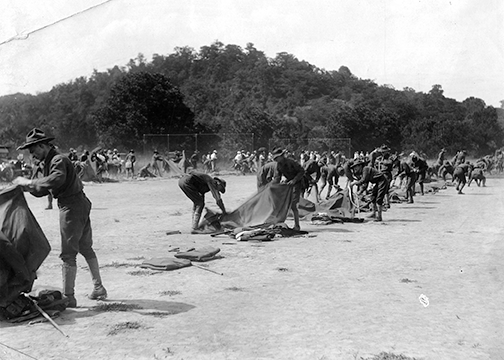 Soldiers from the 1st Infantry Regiment practice setting up “pup” tents at Camp Procter near Cincinnati in August 1917.