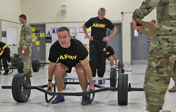 Maj. Brian Eschbach, the 174th Air Defense Artillery Brigade S1 officer, performs the strength deadlift .