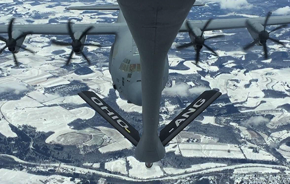 A C-130J Hercules (background) from the Pennsylvania Air National Guard’s 193rd Special Operations Wing approaches a KC-135R Stratotanker of the Ohio Air National Guard’s 121st Air Refueling Wing