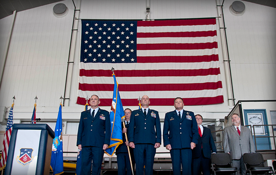 Maj. Gen. Stephen E. Markovich (front row, from left), commander of the Ohio Air National Guard, conducts the official change of command between Col. Gary A. McCue, the outgoing commander of the 179th Airlift Wing, and Col. James R. Camp, the incoming wing commander.