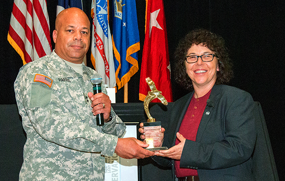 Maj. Gen. John C. Harris Jr., Ohio assistant adjutant general for Army, presents a token of appreciation to Lori Gum.