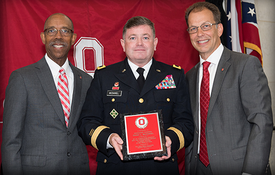 Brig. Gen. Dana L. McDaniel (center), director of joint staff for the Ohio National Guard and city manager of Dublin, Ohio, receives The Ohio State University Alumni Association’s Alumni in Government Award from Dr. Michael Drake (left), OSU president, and Jim Smith, OSU Alumni Association president and CEO.