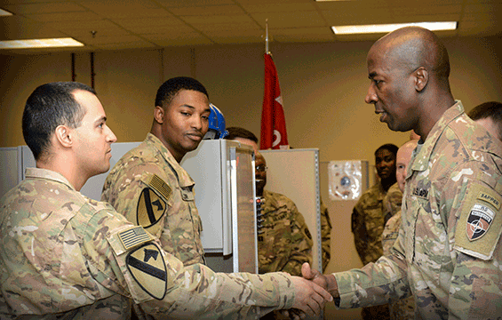 Command Sgt. Maj. David M. Clark (right), senior enlisted leader for NATO’s Resolute Support, U.S. Forces-Afghanistan (USFOR-A), visits with Soldiers from the 204th Engineer Detachment (Construction Management Team), 1st Cavalry Division Resolute Support Sustainment Brigade.
